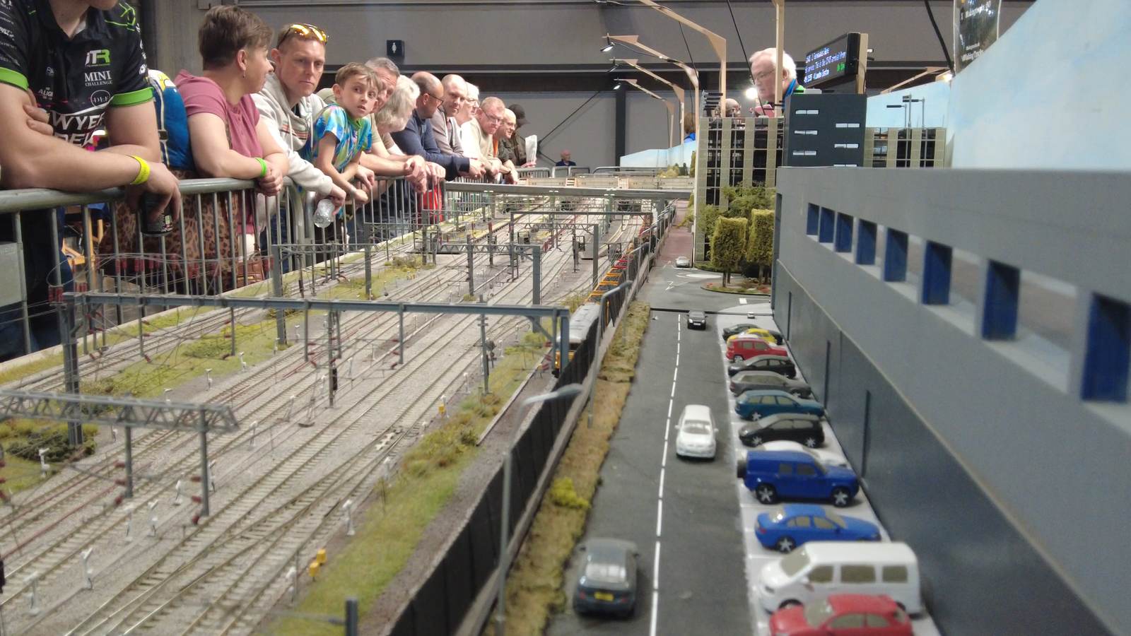 Visitors at the barrier watching trains on the Making Tracks layout