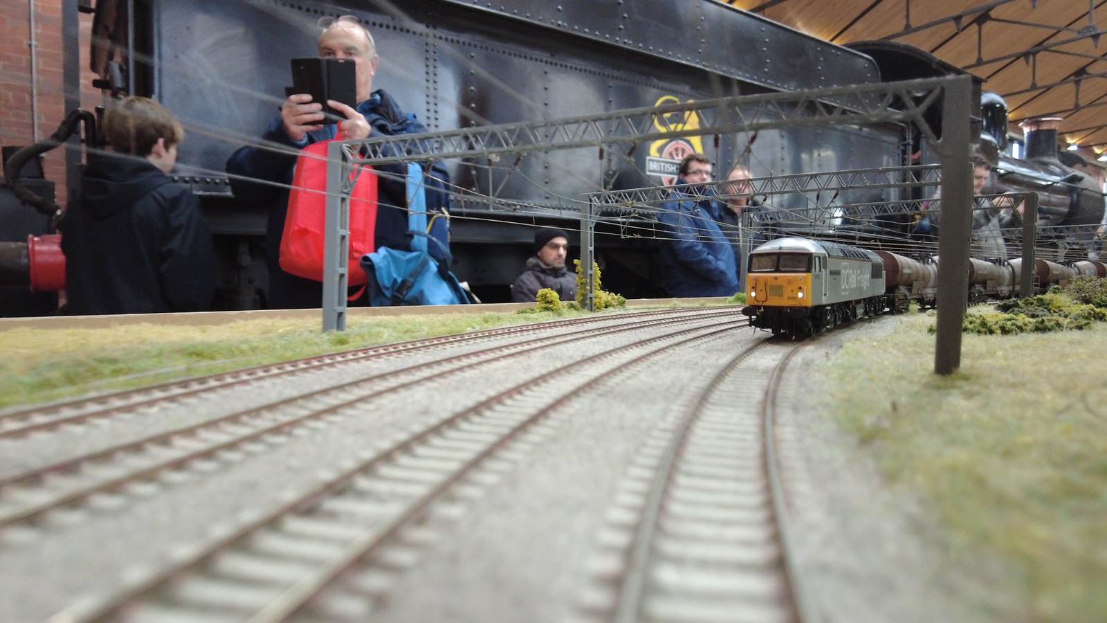 Visitors photographing a locomotive on the Making Tracks layout